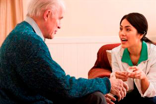 female discussing meds with older man
